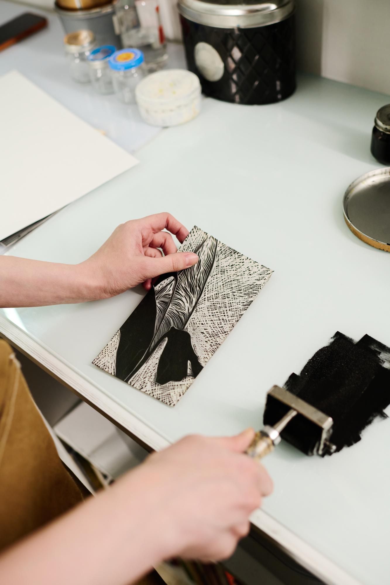 Artist stitching an embroidered panel